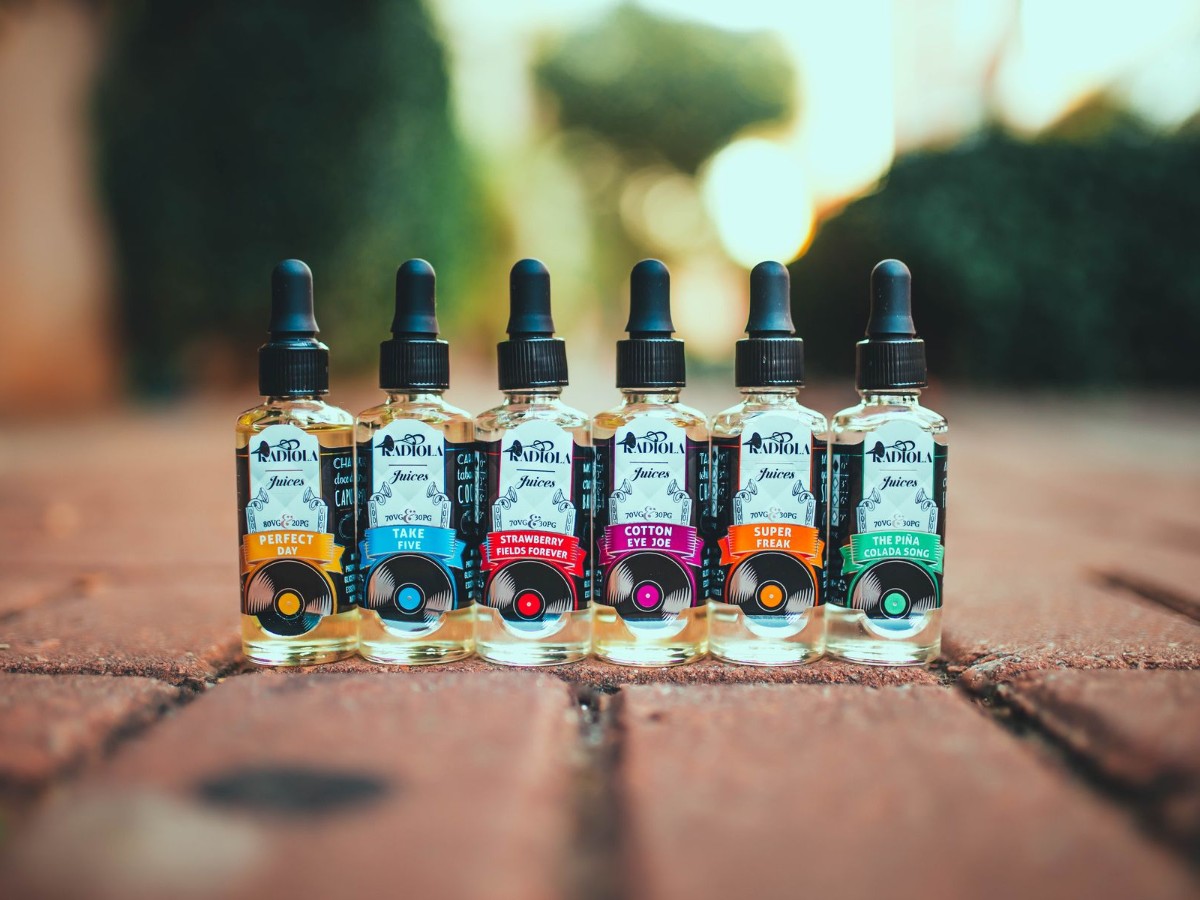 A row of e-liquid flavor bottles A row of e-liquid flavor bottles